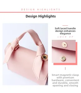 Detail of pink crossbody bag showing bow handle design and gold magnetic closure snap