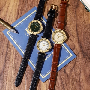 Vintage women's quartz watches with leather straps and Roman numeral gold cases