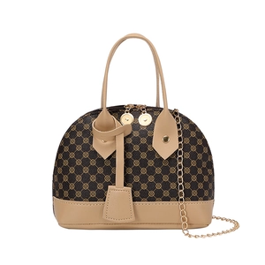 Vintage patterned shell handbag in dark brown and beige with golden chain strap