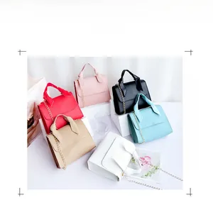 Detailed view of fashionable small square bags in six colors with decorative bow handles