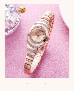 Macro shot of rose gold quartz watch with pavé rhinestone accents and crystal markers