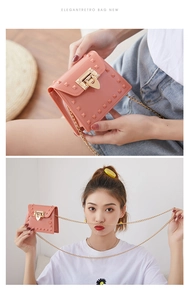 Detail view of pink jelly mini bag with gold chain strap and stud embellishments