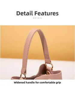Detail of pink faux leather bag with wide comfortable handle and gold metal ring link