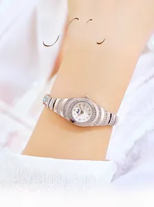 Close-up of Gedi luxury women's bracelet watch with rhinestone-studded bezel on wrist