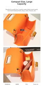 Detail of bright orange jelly bag with crocodile texture and bamboo metal lock