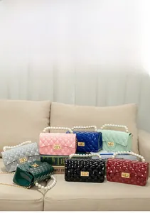 Quilted jelly crossbody bag set with pearl handles and chain straps in seven vibrant colors