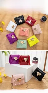 Macro view of jelly mini bag with gold leaf lock, pyramid studs, and chain strap detail