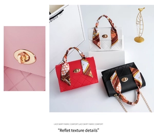 Detailed view of quilted faux leather handbags with silk scarf handle and gold twist lock