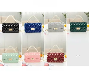 Quilted jelly crossbody bags in various colors with pearl handles and chain straps