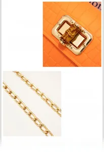 Detail of orange crocodile texture bag with gold bamboo metal lock and chain strap