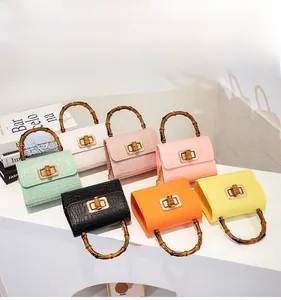 Mini jelly bags with crocodile pattern, retro bamboo handles and metallic turn-locks