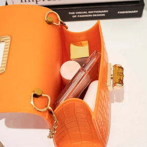 Mini orange silicone jelly bag with crocodile texture, bamboo lock and metal chain strap
