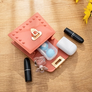 Pink rivet PVC jelly handbag showing spacious interior for lipstick and accessories
