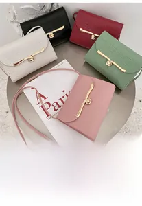 Chic mini crossbody bags with crocodile embossed texture and golden twist locks
