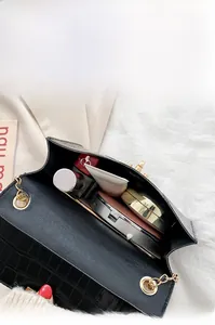 Top view of black crocodile texture bag interior showing space for daily essentials