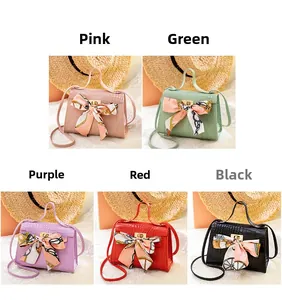 Detail of crocodile pattern mini handbags in five colors with decorative silk scarves