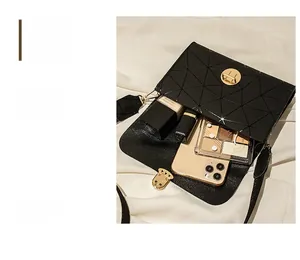 Interior view of black geometric pattern shoulder bag showing storage capacity