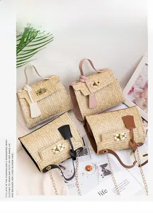 Detailed close-up of woven straw handbags with gold metal locks and chain straps