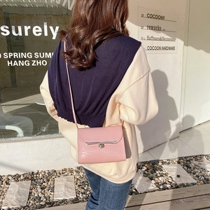 Pink faux crocodile leather mini crossbody flap bag with silver clasp and slim strap