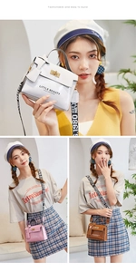 Detail of glossy mini handbags with bow decor and printed wide straps in three colors