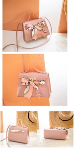 Pink crocodile-embossed mini tote bag with colorful silk scarf and gold hardware