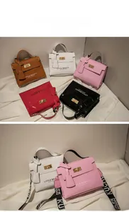 Detailed view of multiple patent leather phone bags with Little Beauty text and metal clasps