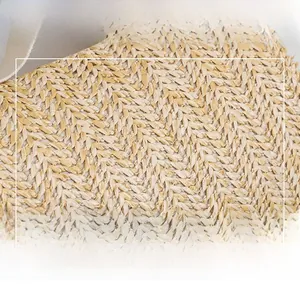 Close-up of high-quality straw woven fabric showing detailed herringbone pattern texture