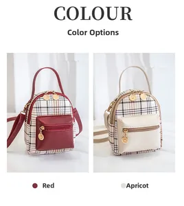 Close-up of red and beige mini plaid backpacks with golden zippers and leather accents