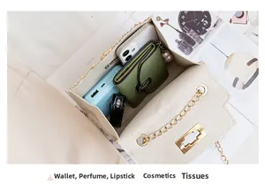Interior view showing the capacity of a beige woven crossbody bag with daily essentials
