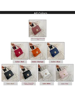 Detail view of colorful faux leather crossbody bags with gold locks and chain straps