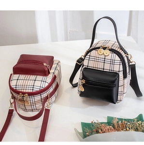 Detailed comparison of red and black mini plaid backpacks with golden zipper accents