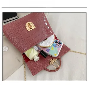 Capacity display of mauve faux leather crocodile pattern small square bag with gold hardware