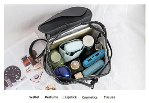 Top view of black quilted backpack showing spacious interior with tablet and daily items
