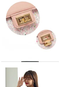 Detail showing pink lychee leather bag with glitter texture and gold metal buckle