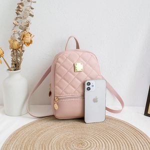 Mini pink quilted backpack for women with gold hardware and stylish compact design