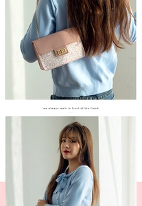 Close-up of pink leather crossbody bag with colorful sequins and golden chain strap