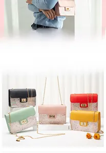 Close-up of glitter sequins chain bags with gold twist locks in five vibrant colors