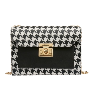Classic houndstooth crossbody mini bag with gold chain strap and metal turn-lock closure