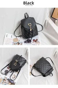 Close-up of quilted black leather backpack with cat ear gold buckle and pearl tassels