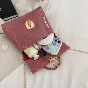 Pink crocodile pattern small square bag with chain strap and gold twist lock closure
