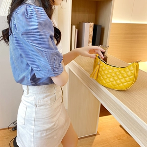 Chic yellow quilted crescent underarm bag with decorative tassel for women's daily style
