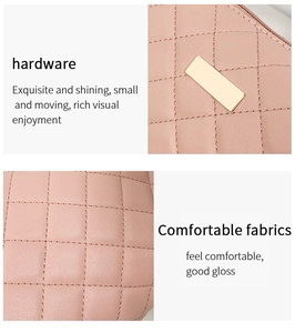 Detail of pink quilted leather texture with small elegant gold hardware on women's bag