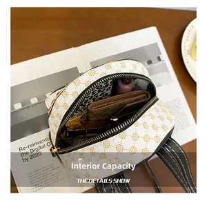 Internal capacity of mini backpack showing phone and lipstick storage details
