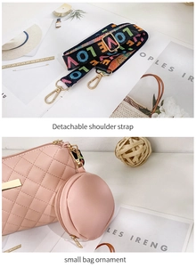 Detail of pink quilted handbag with floral strap and round coin purse attachment