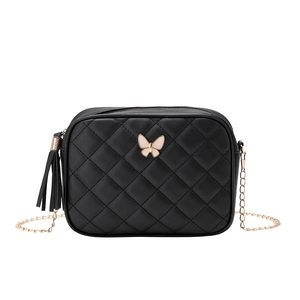 Quilted crossbody camera bag in black leather with gold butterfly buckle and tassel chain