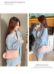 Pink quilted crossbody bag with small coin purse and LOVE lettered wide shoulder strap
