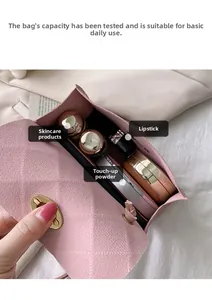Pink matte crossbody bag interior showing storage for phone, lipstick and cosmetics
