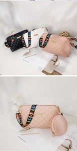 Close-up of quilted PU crossbody bag with love letter strap and mini round pouch