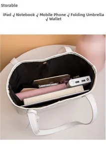 Interno spazioso della borsa tote trapuntata bianca con spazio per tablet e accessori
