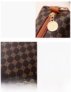 Detailed macro view of gold circular zipper pull and brown floral monogram pattern